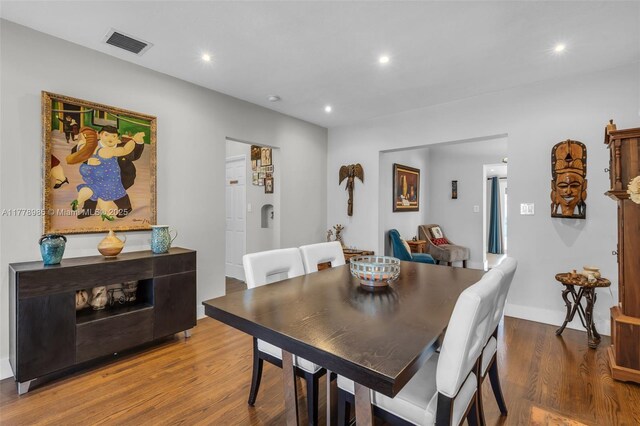 1500 SW 18th St, Miami, FL 33145 - dining room with recessed lighting, a tile fireplace, visible vents, and wood finished floors