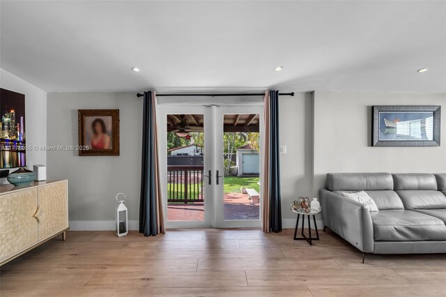 1500 SW 18th St, Miami, FL 33145 - living room featuring light wood finished floors, lofted ceiling, and recessed lighting