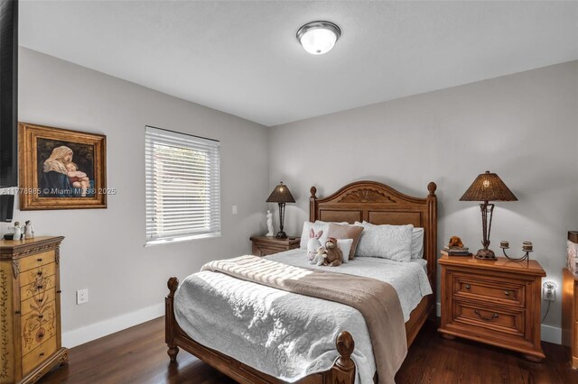 1500 SW 18th St, Miami, FL 33145 - bedroom with dark wood-style flooring and baseboards