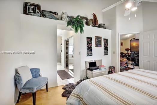 bedroom featuring a ceiling fan and wood finished floors