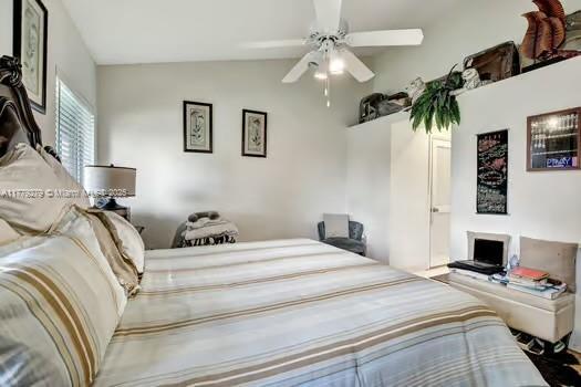 bedroom with ceiling fan and lofted ceiling