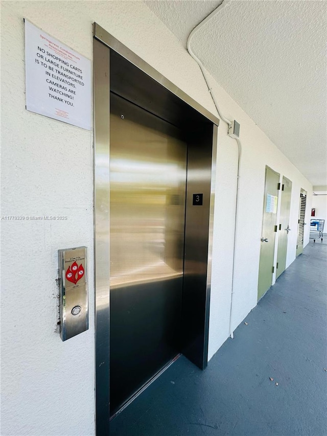 details with stucco siding and elevator