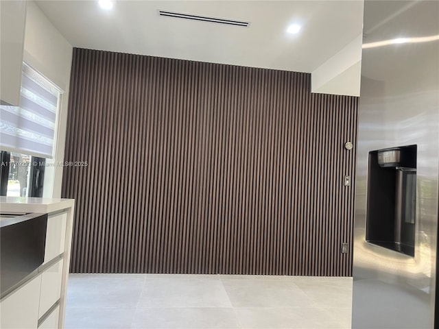details featuring visible vents, white cabinetry, recessed lighting, and modern cabinets
