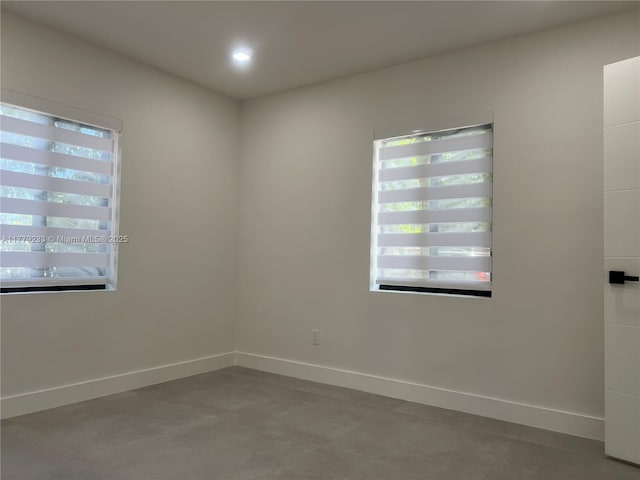 empty room featuring baseboards