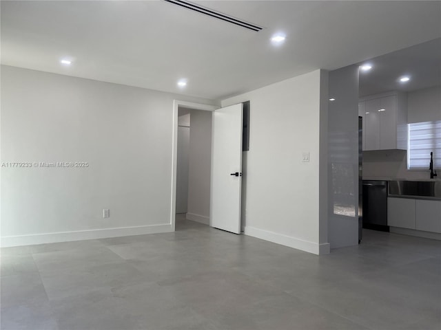 interior space featuring a sink, baseboards, visible vents, and recessed lighting