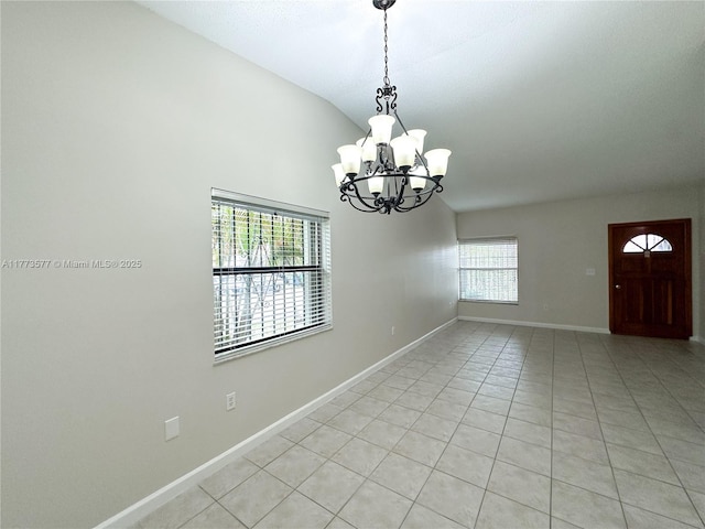 12459 SW 17th Ln, Miami, FL 33175 - unfurnished room featuring lofted ceiling, a chandelier, light tile patterned flooring, and baseboards