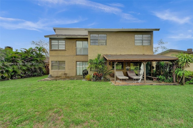 11724 SW 134th Ct, Miami, FL 33186 - rear view of property featuring a patio area, a lawn, and stucco siding