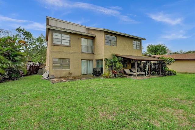 11724 SW 134th Ct, Miami, FL 33186 - back of property featuring a patio, a yard, stucco siding, and fence