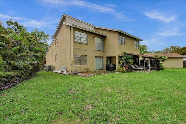 11724 SW 134th Ct, Miami, FL 33186 - back of property with central air condition unit, a yard, and stucco siding