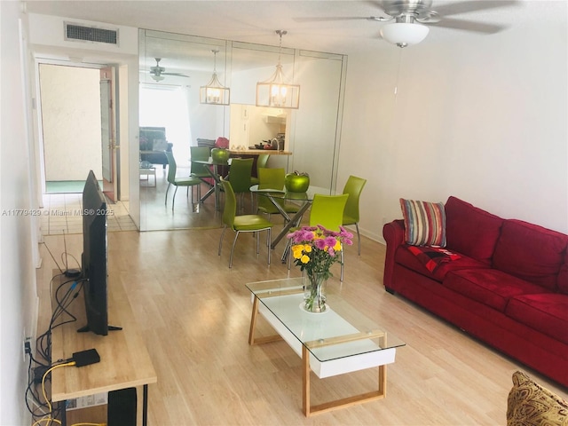 3776 Inverrary Blvd Unit 205R, Lauderhill, FL 33319 - living area featuring ceiling fan and wood finished floors
