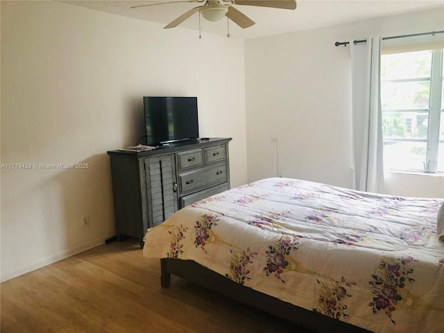 3776 Inverrary Blvd Unit 205R, Lauderhill, FL 33319 - bedroom featuring light wood-type flooring, multiple windows, ceiling fan, and baseboards