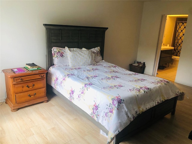 3776 Inverrary Blvd Unit 205R, Lauderhill, FL 33319 - bedroom with light wood-style floors and ensuite bath