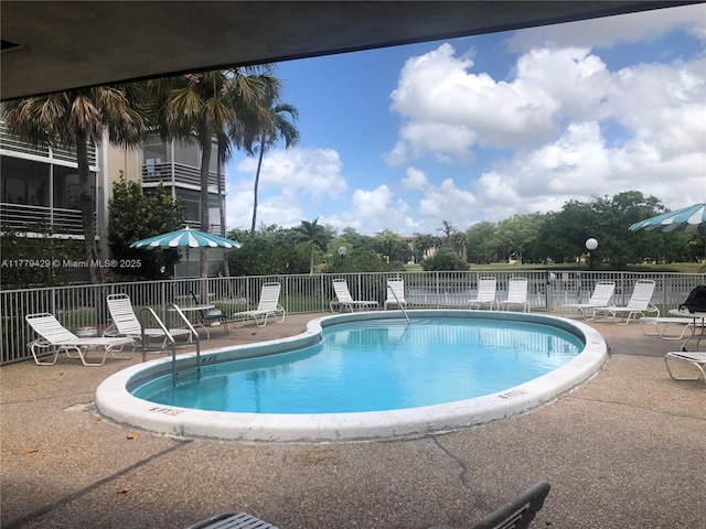 3776 Inverrary Blvd Unit 205R, Lauderhill, FL 33319 - community pool featuring a patio