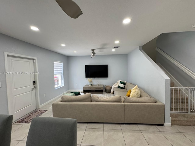 living room with visible vents, baseboards, recessed lighting, stairway, and light tile patterned flooring