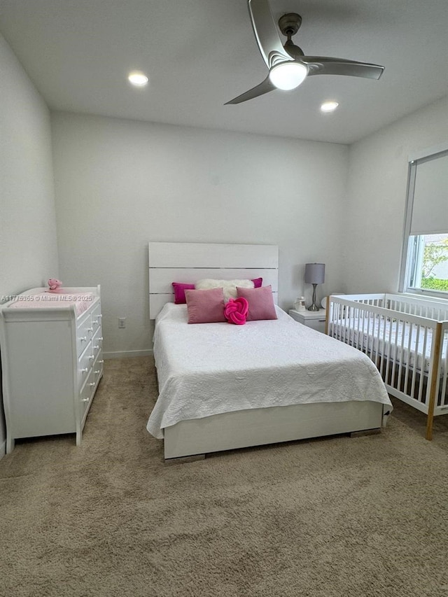 carpeted bedroom featuring baseboards, a ceiling fan, and recessed lighting