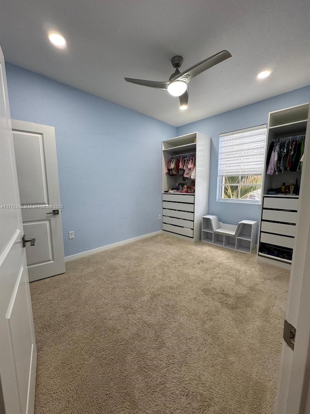unfurnished bedroom featuring recessed lighting, baseboards, a ceiling fan, and carpet floors
