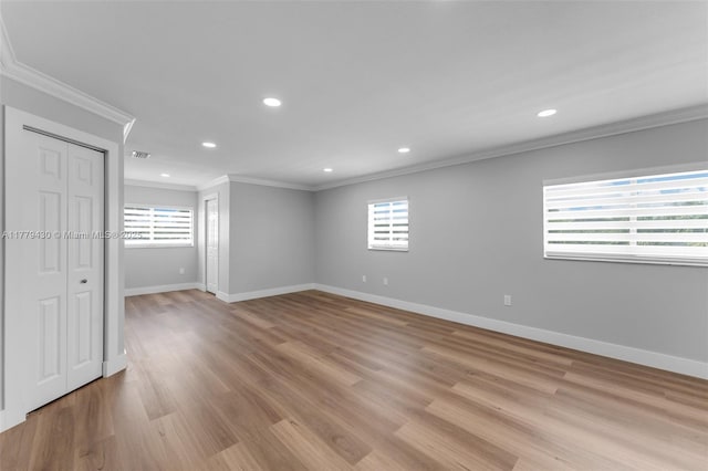 14481 SW 150th St, Miami, FL 33186 - unfurnished room with crown molding, a healthy amount of sunlight, visible vents, and light wood-style floors