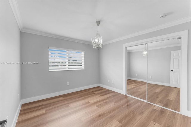 14481 SW 150th St, Miami, FL 33186 - unfurnished bedroom with light wood-style floors, an inviting chandelier, crown molding, and baseboards