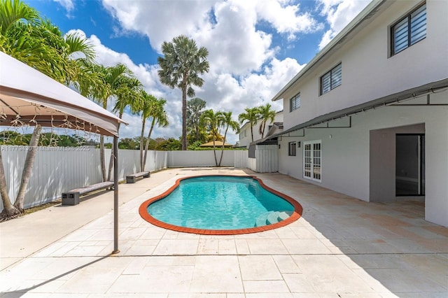 14481 SW 150th St, Miami, FL 33186 - view of pool with french doors, a fenced backyard, a fenced in pool, and a patio