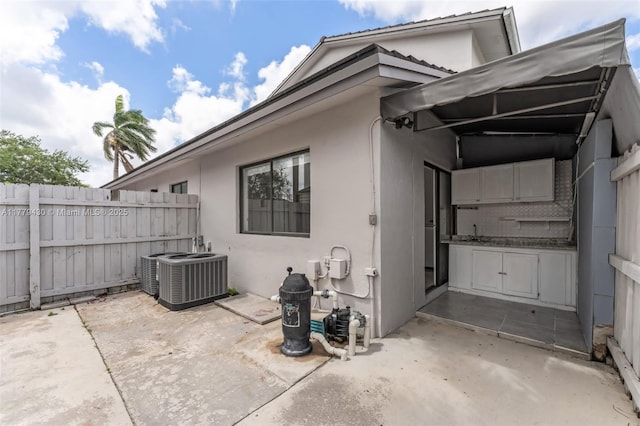 14481 SW 150th St, Miami, FL 33186 - exterior space featuring central AC and fence