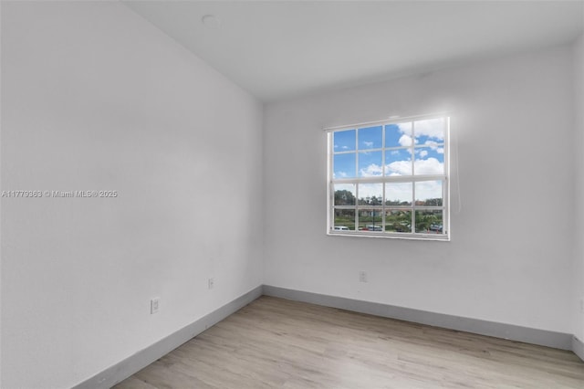 1720 NE 33rd Ave Unit 104-5, Homestead, FL 33033 - spare room with baseboards and light wood finished floors