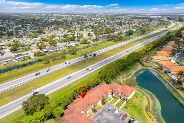 bird's eye view with a water view and a residential view