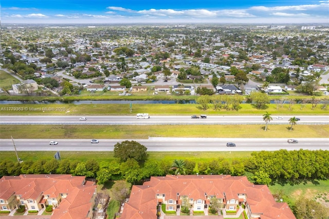 aerial view featuring a water view and a residential view