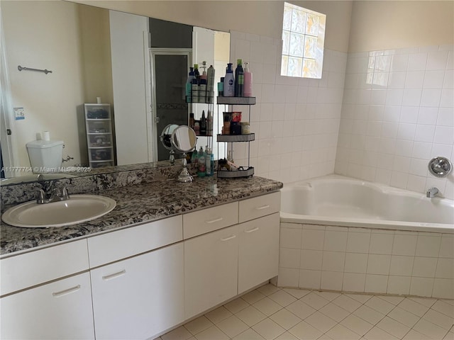 full bathroom with a tile shower, vanity, tile patterned floors, and tiled bath