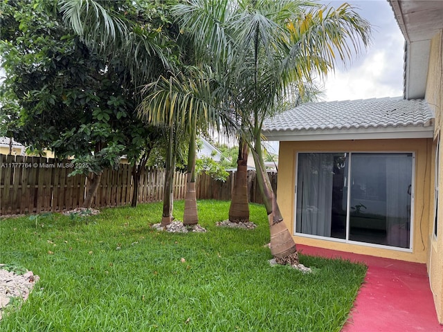 view of yard with a fenced backyard