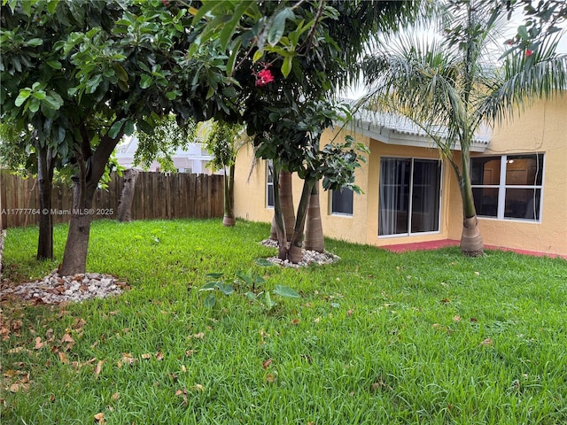 view of yard featuring fence