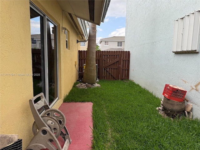 view of yard featuring a gate and fence