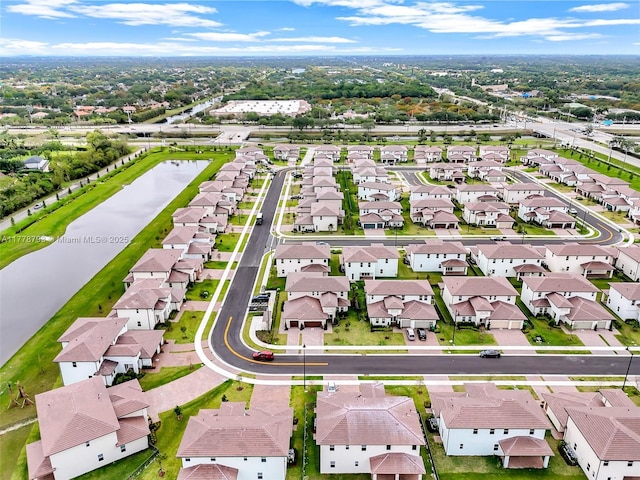 aerial view featuring a water view and a residential view