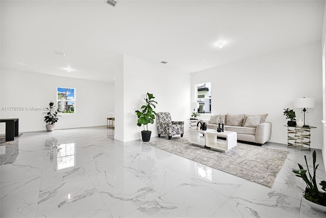 living room featuring marble finish floor