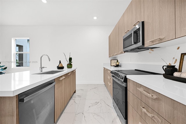 kitchen with modern cabinets and appliances with stainless steel finishes