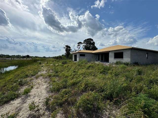 509 Glendale Ave, La Belle, FL 33935 - rear view of house featuring concrete block siding