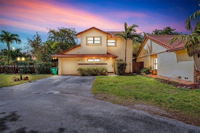 15026 SW 96th Ter, Miami, FL 33196 - mediterranean / spanish house featuring a yard, aphalt driveway, fence, and a tile roof