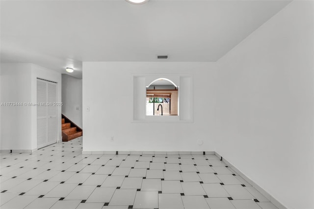 15026 SW 96th Ter, Miami, FL 33196 - spare room with a sink, baseboards, visible vents, and stairs
