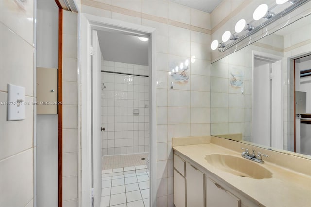 15026 SW 96th Ter, Miami, FL 33196 - bathroom featuring a shower stall, vanity, and tile walls