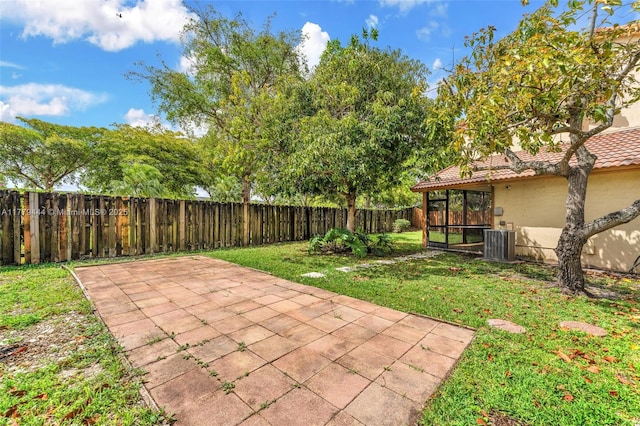15026 SW 96th Ter, Miami, FL 33196 - exterior space with a fenced backyard and central air condition unit