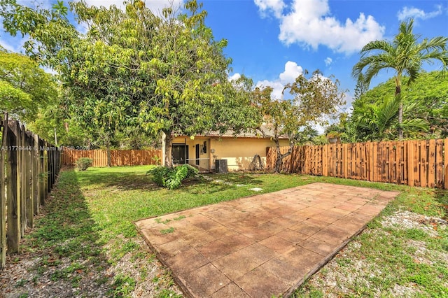 15026 SW 96th Ter, Miami, FL 33196 - view of yard featuring a patio area and a fenced backyard