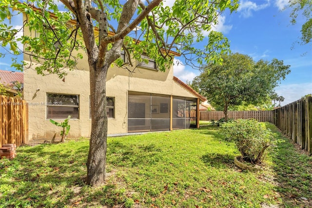 15026 SW 96th Ter, Miami, FL 33196 - view of yard with a fenced backyard and a sunroom