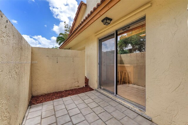 15026 SW 96th Ter, Miami, FL 33196 - view of patio / terrace featuring fence