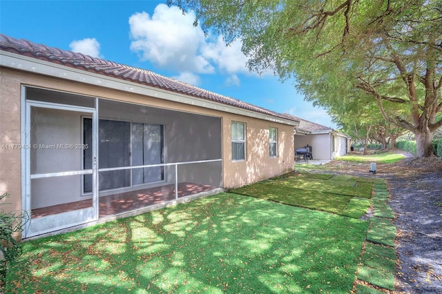 1617 Zenith Way, Weston, FL 33327 - view of home's exterior with a tile roof, a lawn, and stucco siding