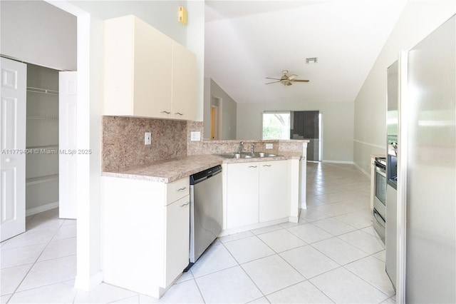 1617 Zenith Way, Weston, FL 33327 - kitchen with appliances with stainless steel finishes, a sink, light countertops, light tile patterned floors, and vaulted ceiling