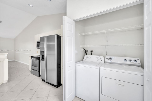 1617 Zenith Way, Weston, FL 33327 - laundry room with washing machine and clothes dryer, light tile patterned floors, and baseboards