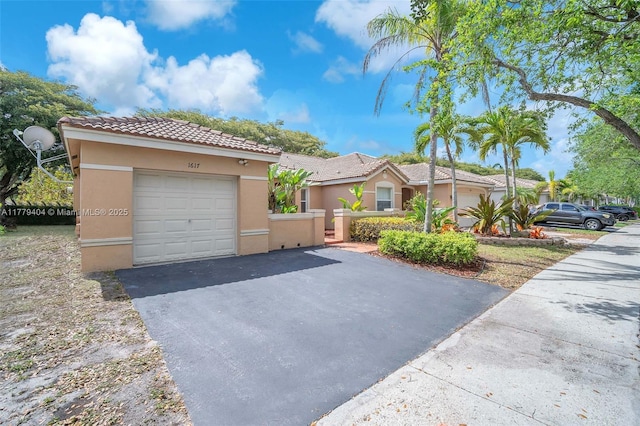 1617 Zenith Way, Weston, FL 33327 - view of front facade with a tiled roof, stucco siding, driveway, and an attached garage