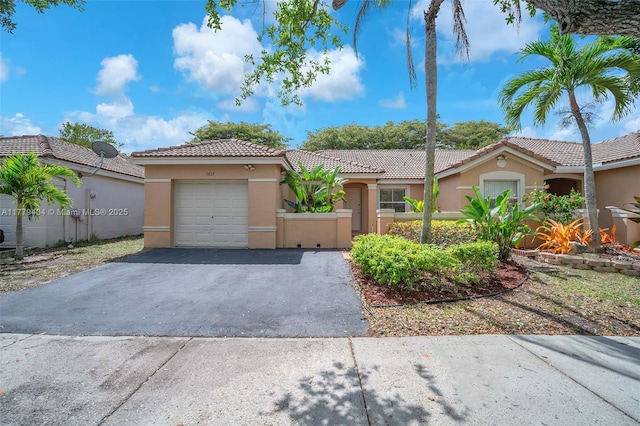 1617 Zenith Way, Weston, FL 33327 - view of front facade with a garage, driveway, stucco siding, and a tile roof