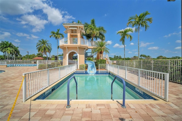 1617 Zenith Way, Weston, FL 33327 - community pool with a water slide, fence, and a patio area