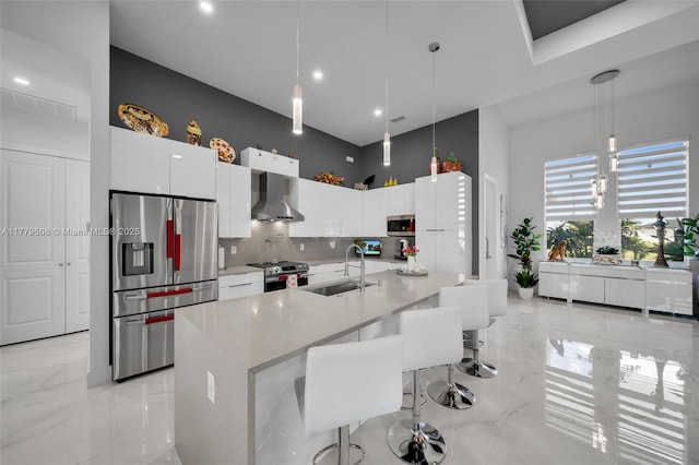 1214 Embers Pkwy, Cape Coral, FL 33993 - kitchen with white cabinets, wall chimney exhaust hood, a sink, appliances with stainless steel finishes, and marble finish floor