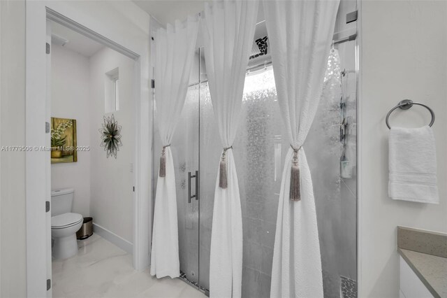 1214 Embers Pkwy, Cape Coral, FL 33993 - bathroom featuring a shower stall, marble finish floor, baseboards, and toilet